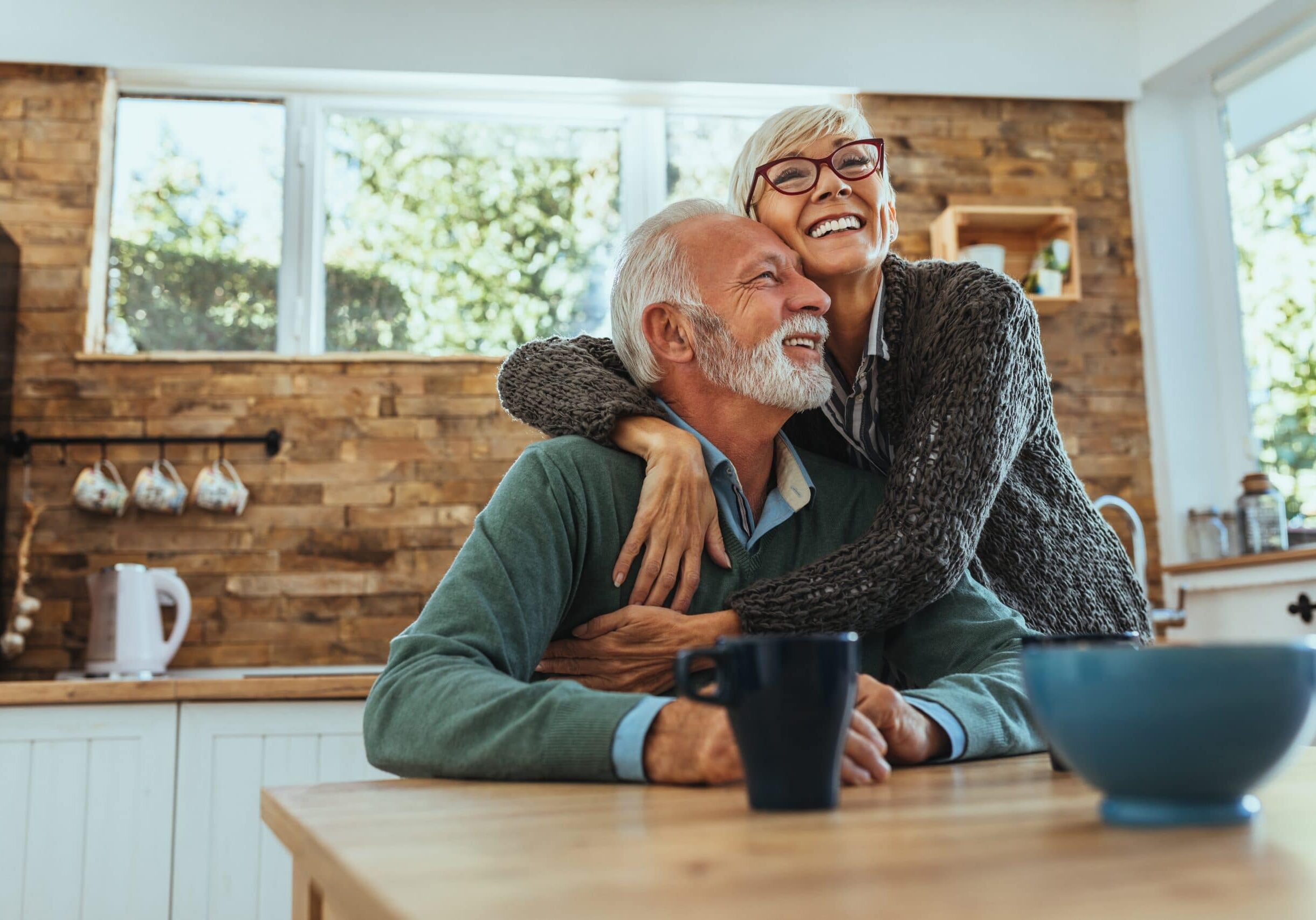 Mature woman hugging her husband